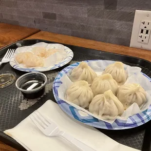Soup dumplings and shrimp dumplings.
