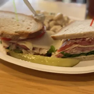 Sandwich with pickle and macaroni salad