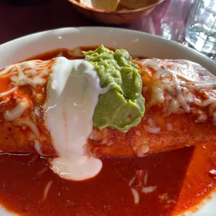 Great beef burritos- shredded tender beef, flavorful red sauce, cheese, guacamole, sour cream, rice, lettuce - a huge dinner burrito!