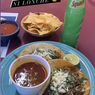 Birria tacos con consomé, chips and salsa, and a refreshing Squirt.