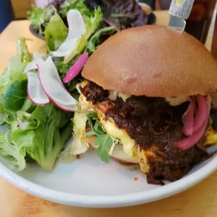 Breakfast sandwich - smoked bacon, balbacoa, chipotle aioli, scramble eggs and cheddar on brioche bun