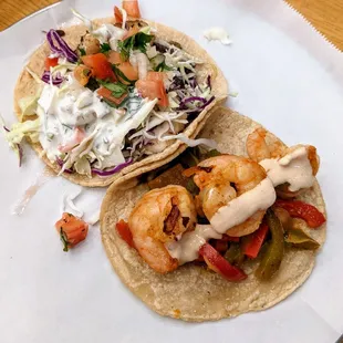 Fish taco left, shrimp taco on the right.