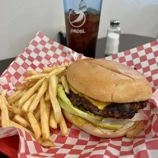 a burger and fries on a table