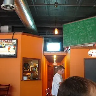 a man watching television in a restaurant
