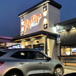Glory days front door  equipped with corn  hole set in between parking spots and entrance.