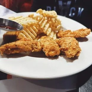 a plate of fried chicken and french fries