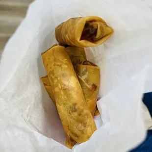 a person holding a bag of food