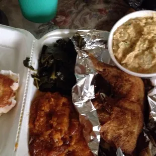 Nicely fried chicken leg quarter, greens, sweet potatoes, corn muffin and potato salad.