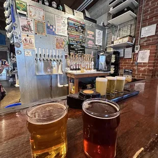 two pints of beer on a bar