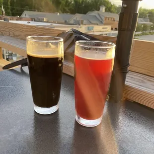 two glasses of beer on a table