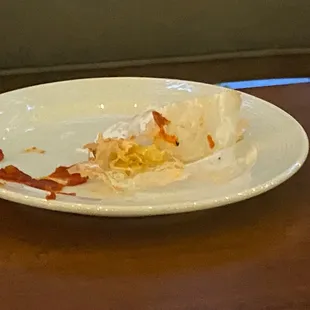 Doily under the pizza that we almost ate.