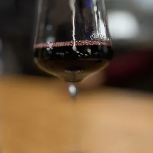 a glass of wine on a table