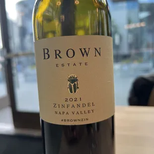 a bottle of brown estate zinfandel