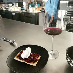 Basque fruit tart and glass of Beaujolais