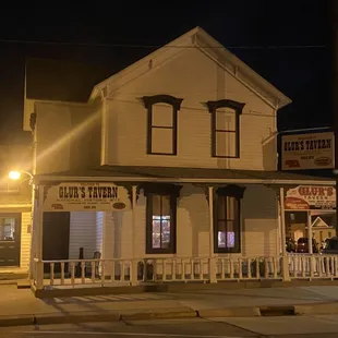 The glow of the historic tavern at night.