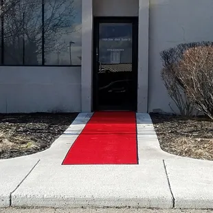 Welcome! Look for the red carpet outside, and the red carpet treatment inside