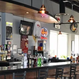 a bar with chairs and tables