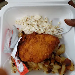 Egg whites home fries and fried chicken patty.