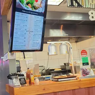 a large flat screen tv mounted above the counter