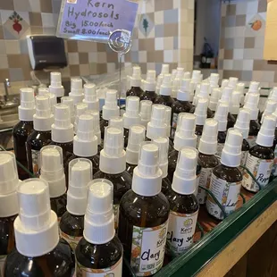 a counter with many bottles of liquid