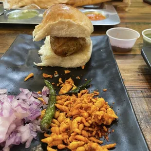 Vada pav, plain with toppings on the side
