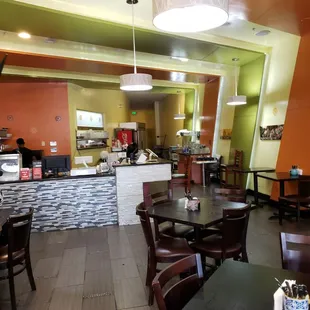 a restaurant with tables and chairs