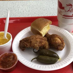 Snack meal (2 pieces dark) with mashed potatoes and roll plus added jalapeños and hot sauce