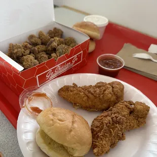 a plate of fried chicken and a sandwich
