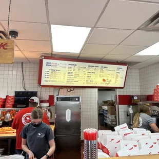 a man standing in a restaurant kitchen