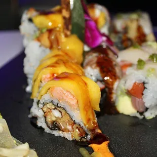 The Bad Daddy is made with spicy lobster, eel &amp; avocado topped with soft shell crab, mango &amp; mango sauce