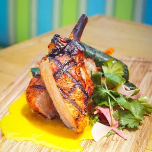 Achiote Marinated Pork Chop * grilled summer squash, charred rainbow carrots, mezcal achiote crema