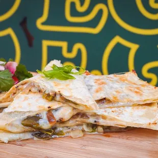 Quesadilla * queso oaxaca, grilled poblano peppers, grilled red onions, flour tortilla, guac, crema, salsa