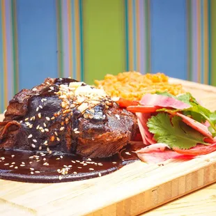 Braised Beef Short Rib * oaxacan mole, red pickled onions, toasted sesame seeds, cotija cheese, red rice