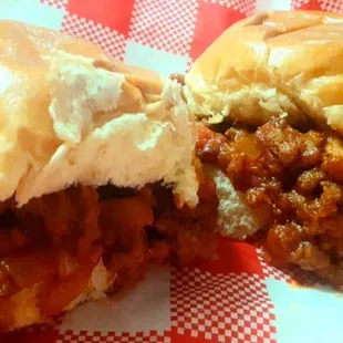 a sloppy joe sandwich with a bite taken out of it