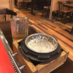 a bowl of rice and a glass of beer