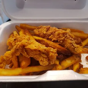 Chicken tenders with fries.