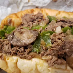 Supreme cheesesteak with bell peppers and jalapeños