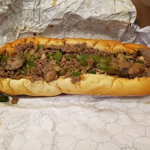 Supreme cheesesteak with bell peppers and jalapeños