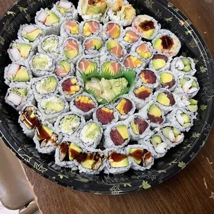 a plate of sushi rolls on a table