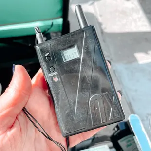 a hand holding a cell phone