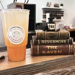 a cup of tea and a stack of books