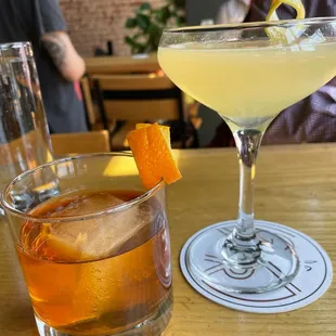 two cocktails on a table