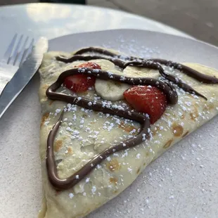 An all time favorite crepe. Strawberries bananas and Nutella