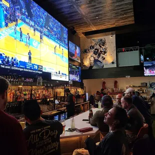 Huge screen over bar with lots of big screens all around