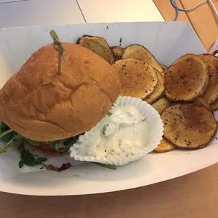 Turkey burger with a small order of potato rounds and dill sauce!