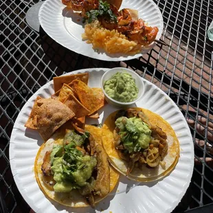 Chicken tacos and shrimp skewers with rice