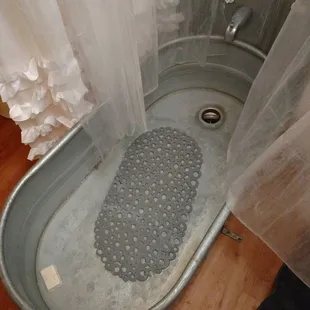 a bathtub with a shower curtain