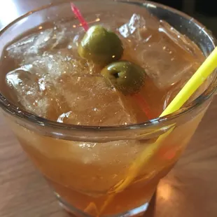 Whiskey sour old fashioned with green olives