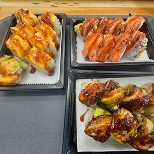 three trays of food on a table