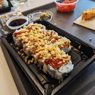a tray of sushi on a table